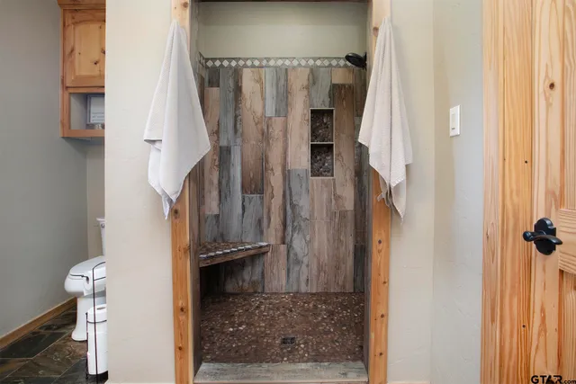 a bathroom with a shower curtain and a shower curtain