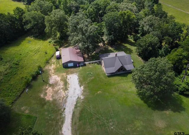 an aerial view of a golf course with swimming pool