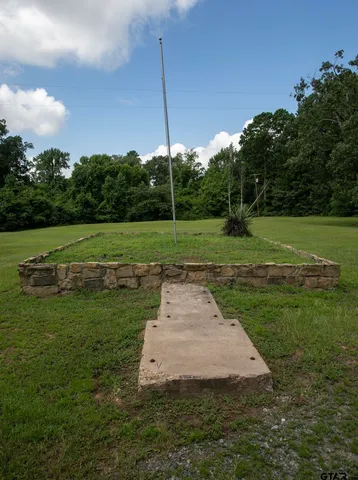 a backyard of a house with yard and garage