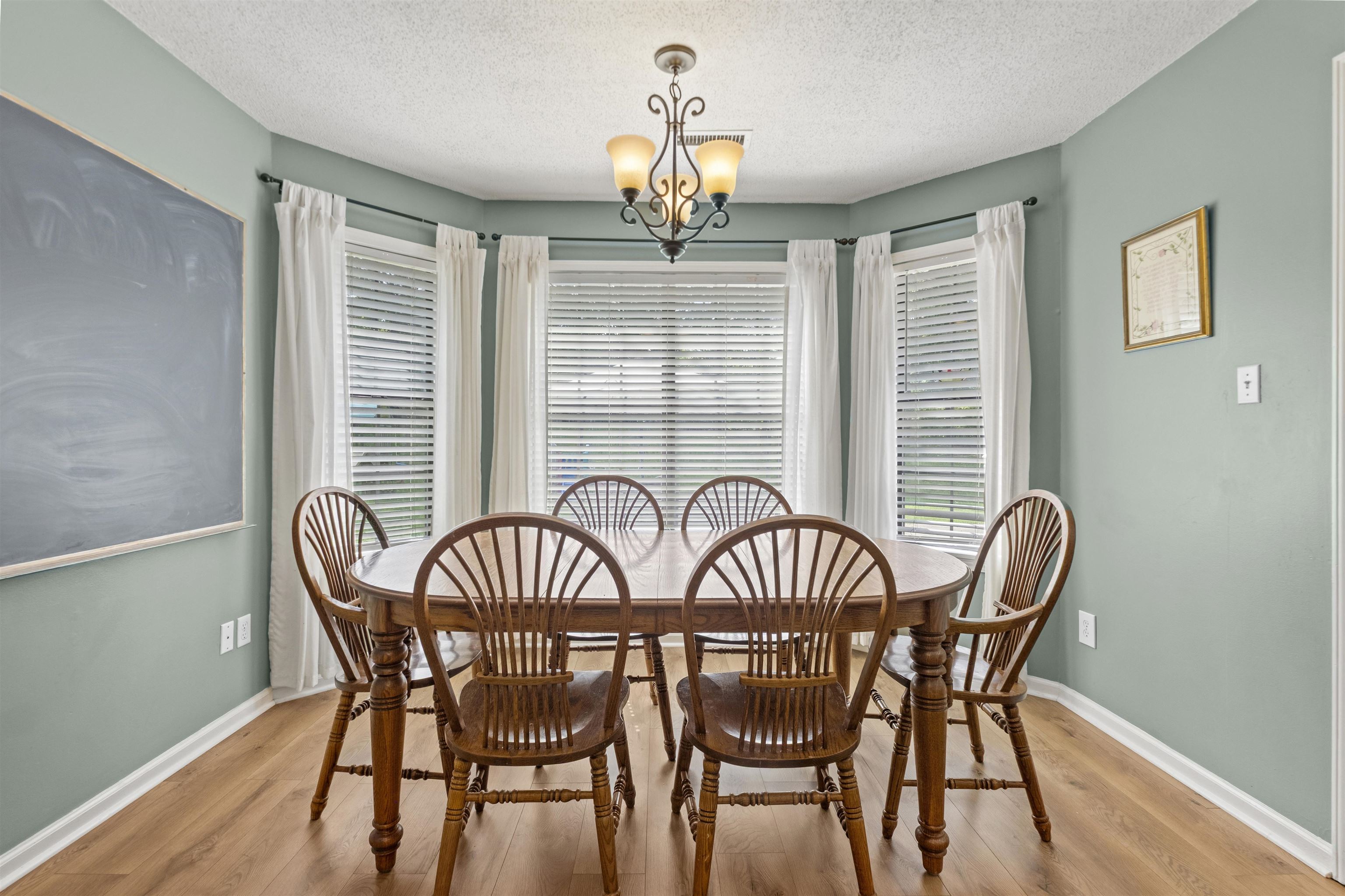 3601 Marshall Road Munford, TN 38058 - Photo 24 of 35 Bay window area with wood-finish flooring and a central chandelier