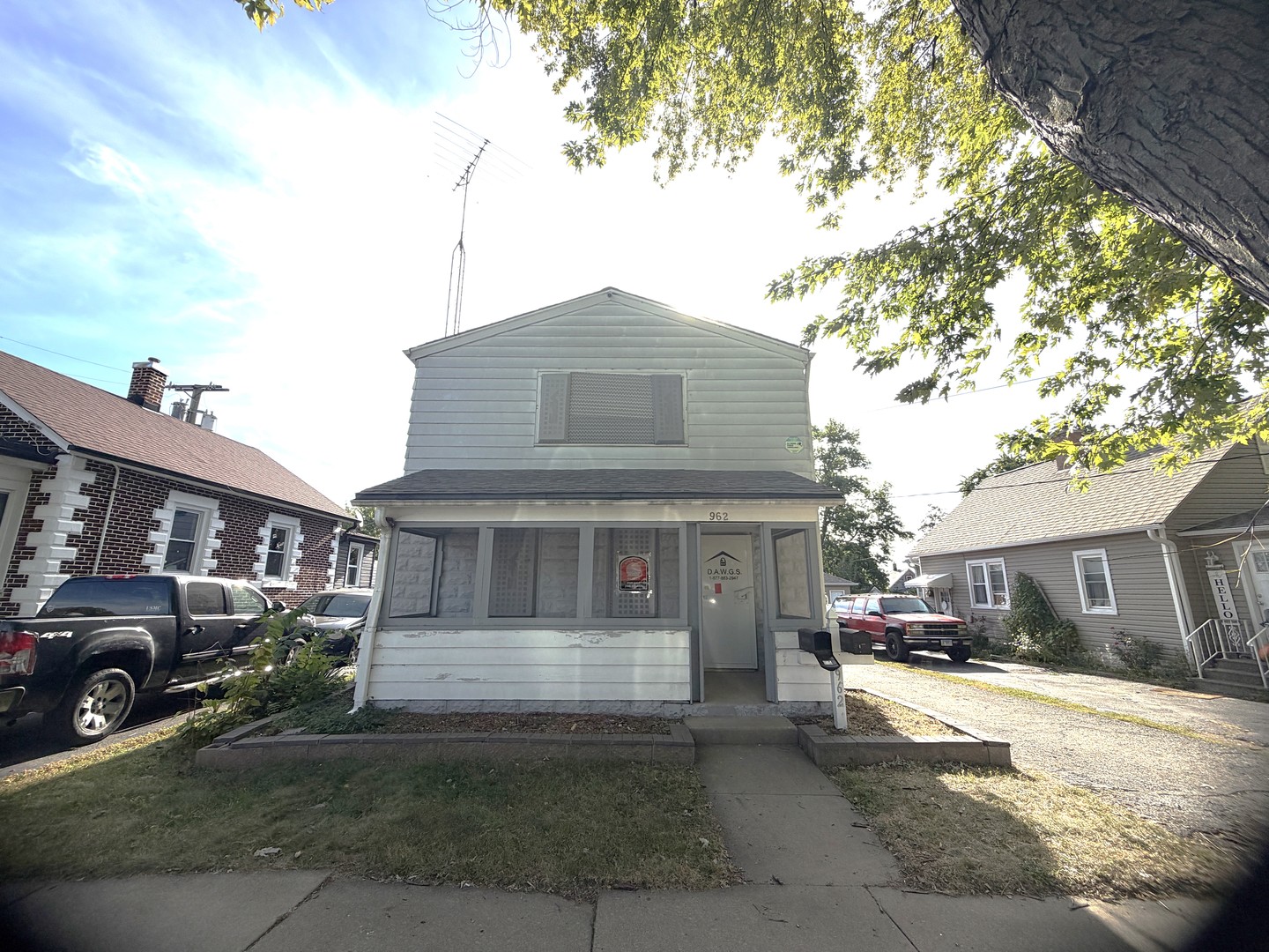 962 Oliver Avenue Aurora, IL 60506 - Photo 1 of 17 a front view of a house with a yard