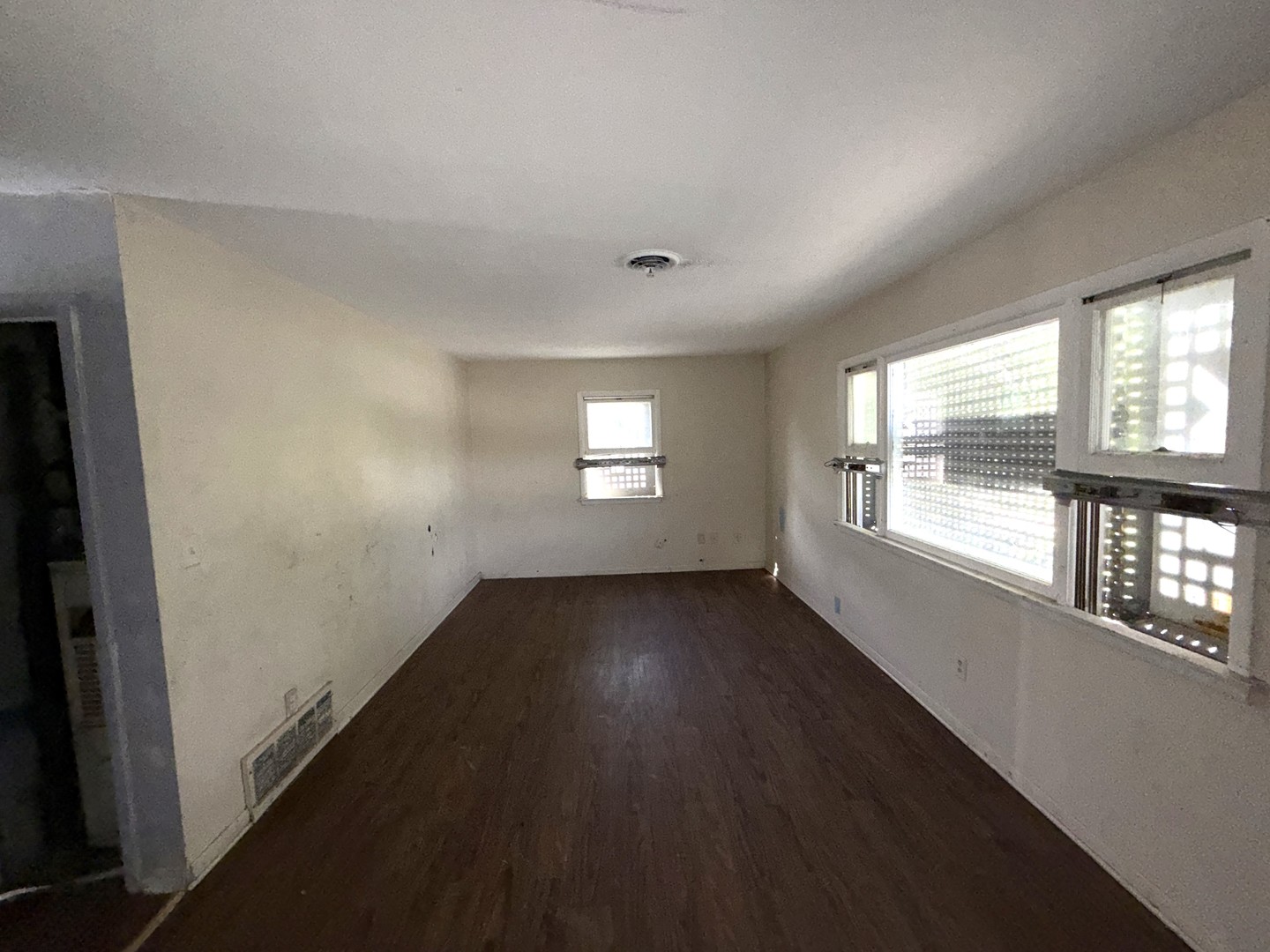 962 Oliver Avenue Aurora, IL 60506 - Photo 11 of 17 an empty room with wooden floor and windows
