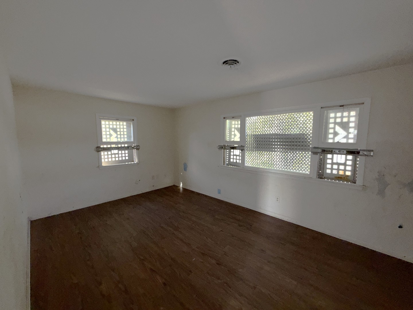 962 Oliver Avenue Aurora, IL 60506 - Photo 12 of 17 a view of an empty room with wooden floor and a window