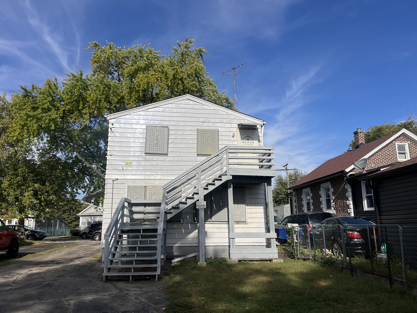 962 Oliver Avenue Aurora, IL 60506 - Photo 3 of 17 a front view of a house with a yard