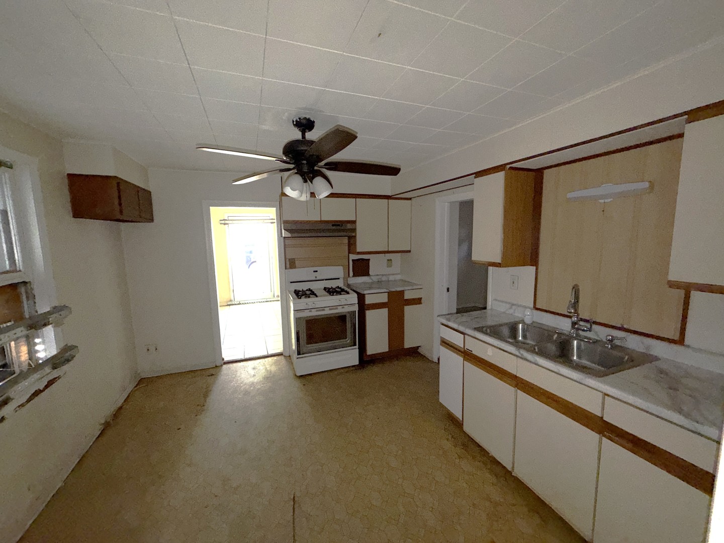 962 Oliver Avenue Aurora, IL 60506 - Photo 6 of 17 a kitchen with stainless steel appliances a sink and a refrigerator
