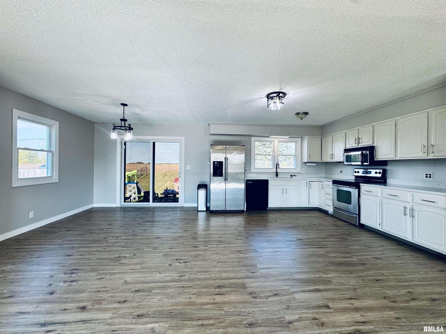 708 Tower Road Clinton, IA 52732 - Photo 11 of 34 a view of a kitchen with stove and cabinets