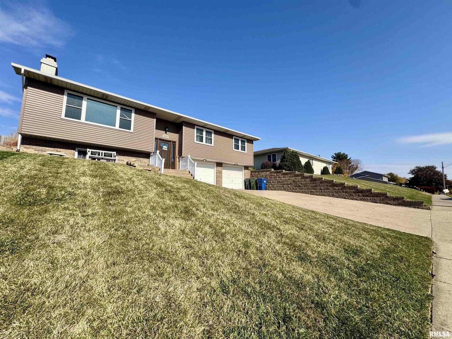 708 Tower Road Clinton, IA 52732 - Photo 2 of 34 a backyard of a house with lots of green space