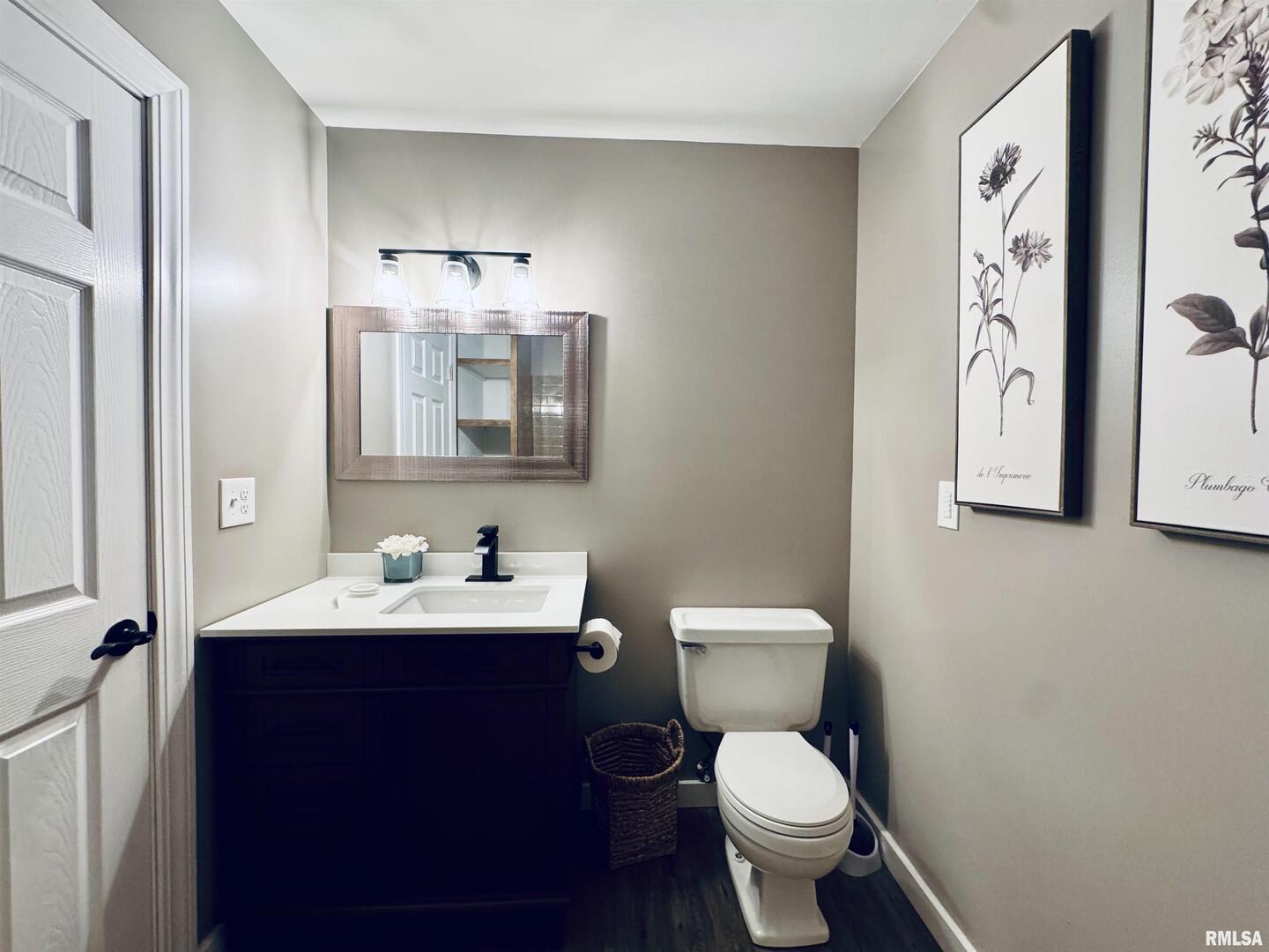 708 Tower Road Clinton, IA 52732 - Photo 22 of 34 a bathroom with a toilet sink and mirror