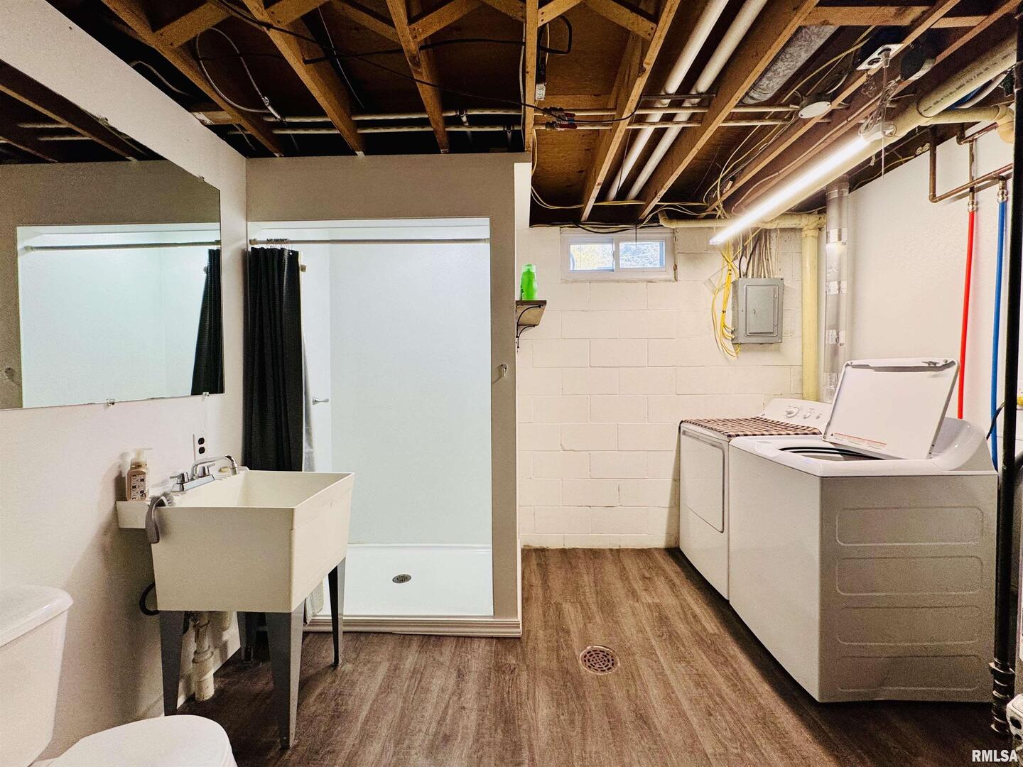 708 Tower Road Clinton, IA 52732 - Photo 27 of 34 a bathroom with a sink mirror vanity and toilet