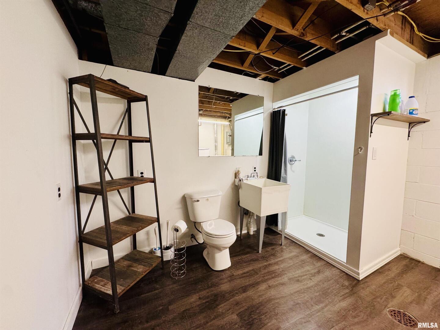 708 Tower Road Clinton, IA 52732 - Photo 28 of 34 a bathroom with a toilet sink and a window