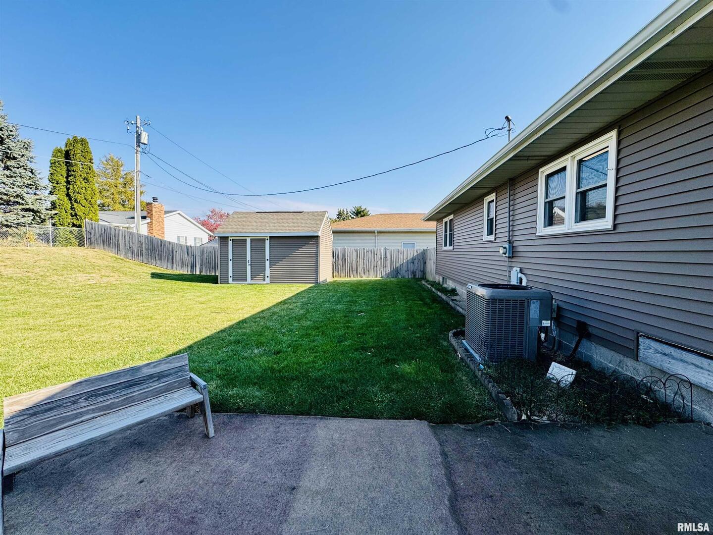 708 Tower Road Clinton, IA 52732 - Photo 31 of 34 a view of a patio with a table and chairs next to yard