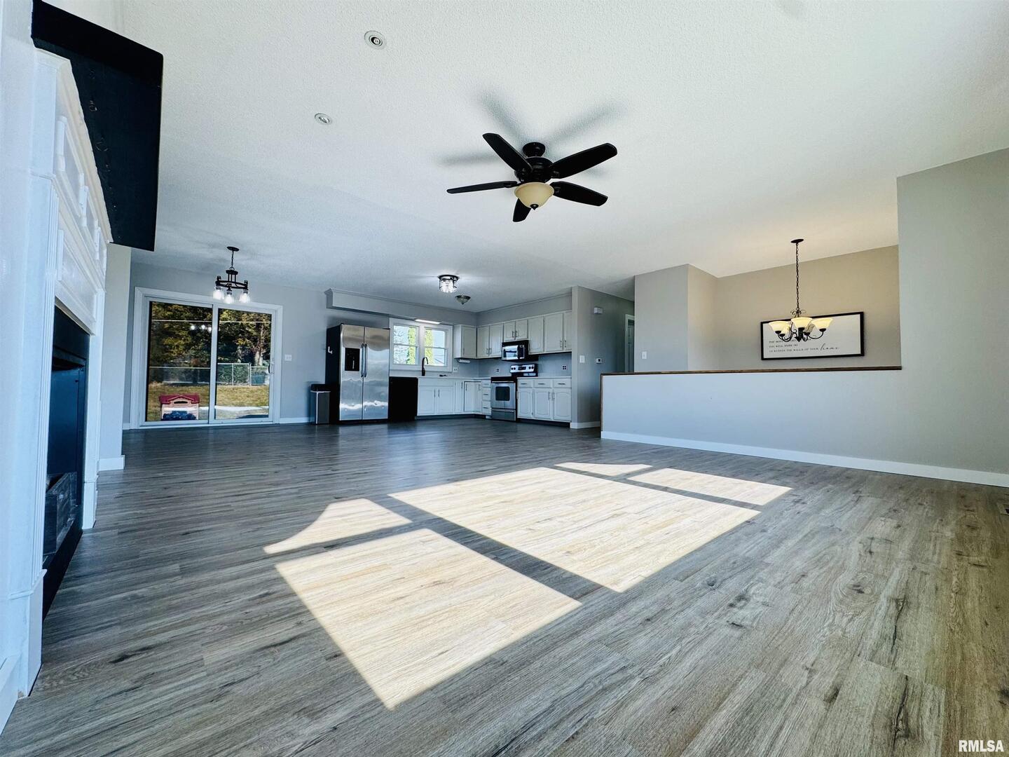 708 Tower Road Clinton, IA 52732 - Photo 8 of 34 a living room with furniture and a flat screen tv