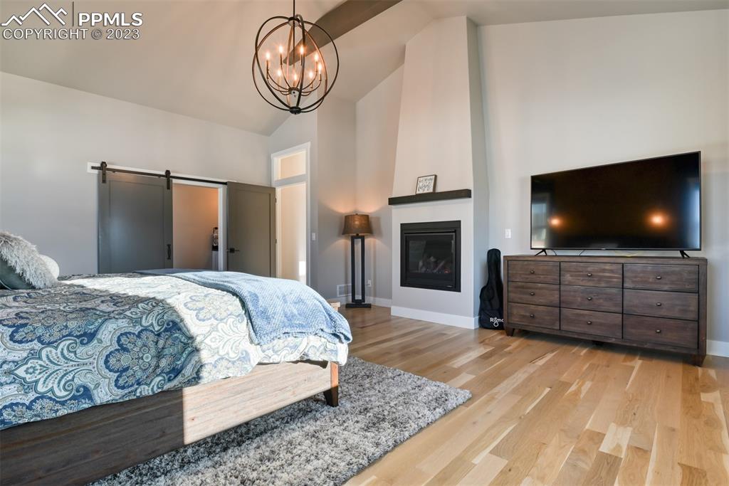 14149 Stone Eagle Place Colorado Springs, CO 80921 - Photo 36 of 47 a living room with furniture flat screen tv and a fireplace