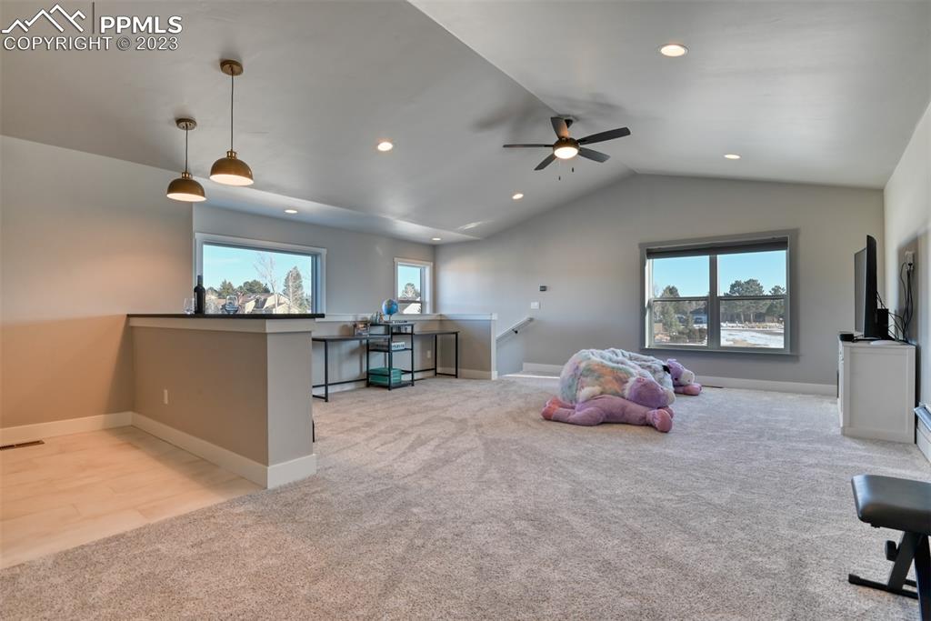 14149 Stone Eagle Place Colorado Springs, CO 80921 - Photo 40 of 47 a living room with furniture and a flat screen tv