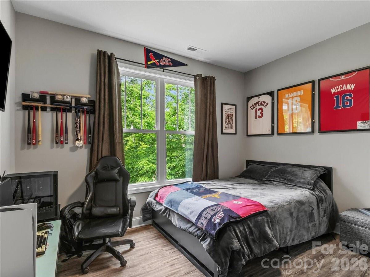 36 Cherry Ridge Lane Weaverville, NC 28787 - Photo 27 of 37 a bedroom with a bed a dresser and a large window