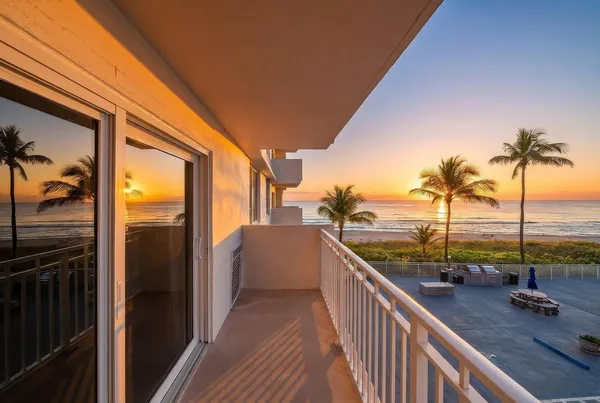 a view of a balcony with ocean view