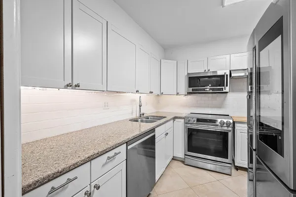 a kitchen with a stove and a microwave