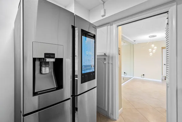 a view of a kitchen from the hallway