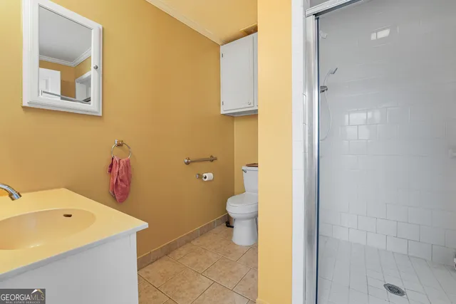 a view of a room with wooden floor and windows