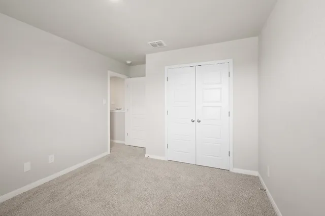 a bathroom with a granite countertop toilet a sink and a bathtub