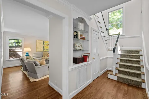a room with wooden floor and furniture