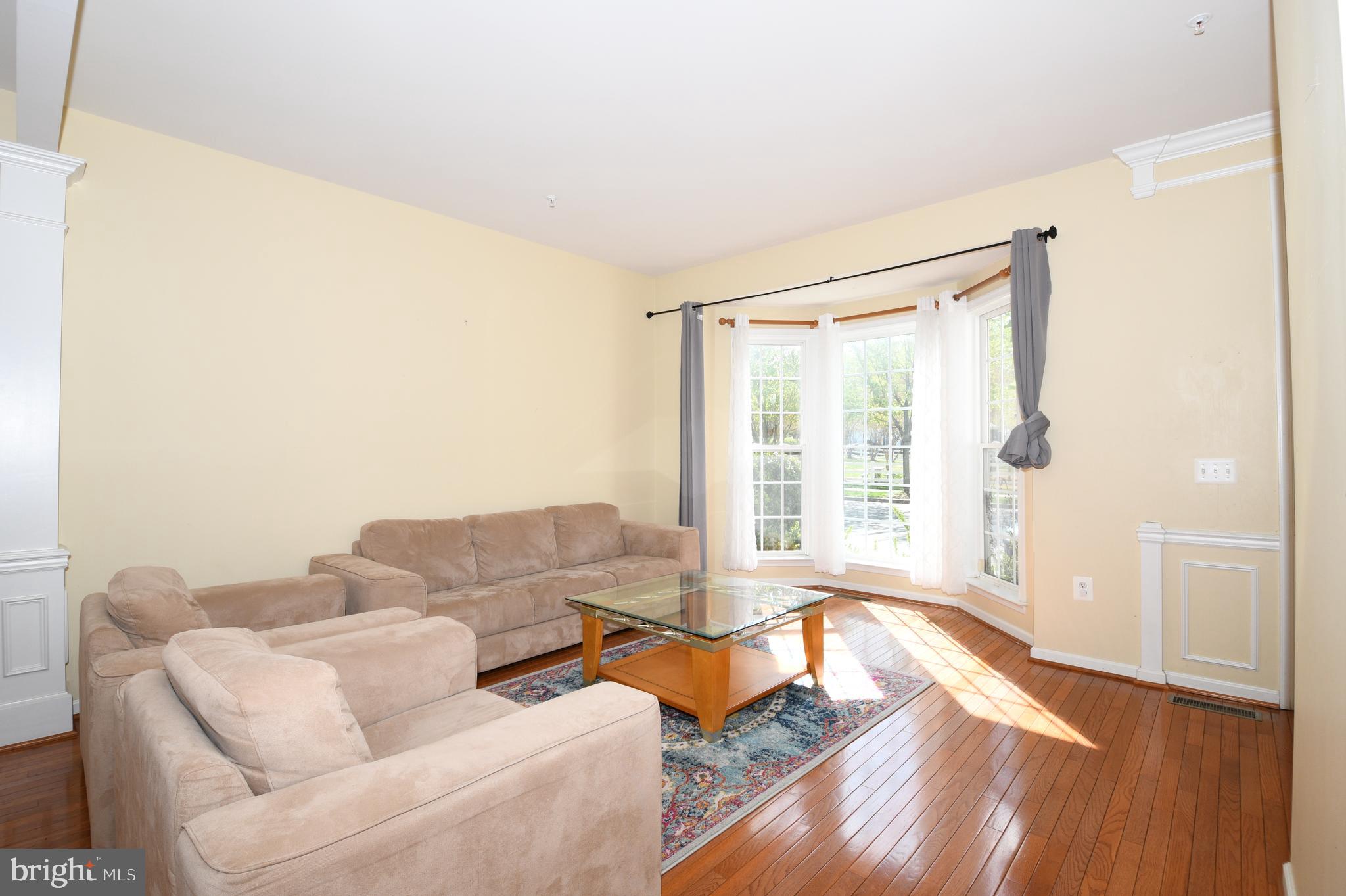 13955 Lullaby Road Germantown, MD 20874 - Photo 6 of 45 a living room with furniture and a large window