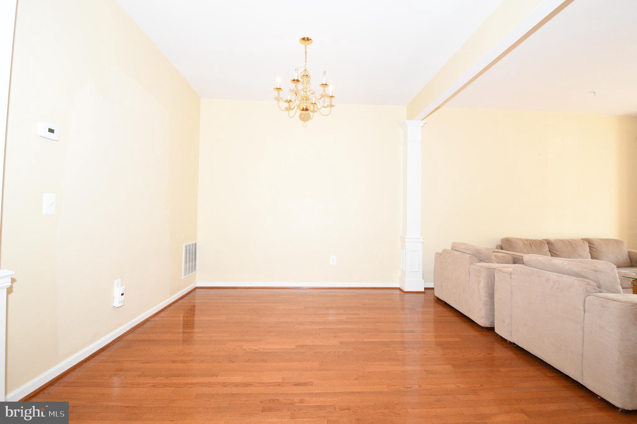 13955 Lullaby Road Germantown, MD 20874 - Photo 8 of 45 a view of a room with wooden floor