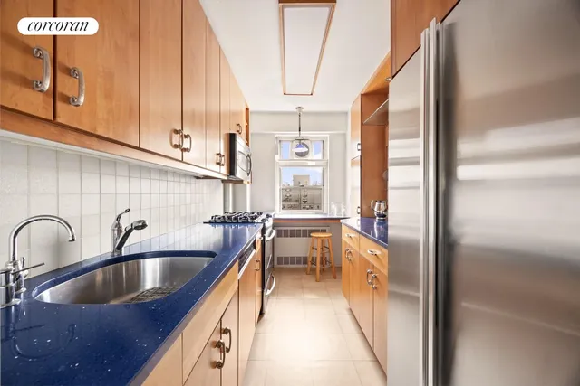 a kitchen with a sink and a refrigerator
