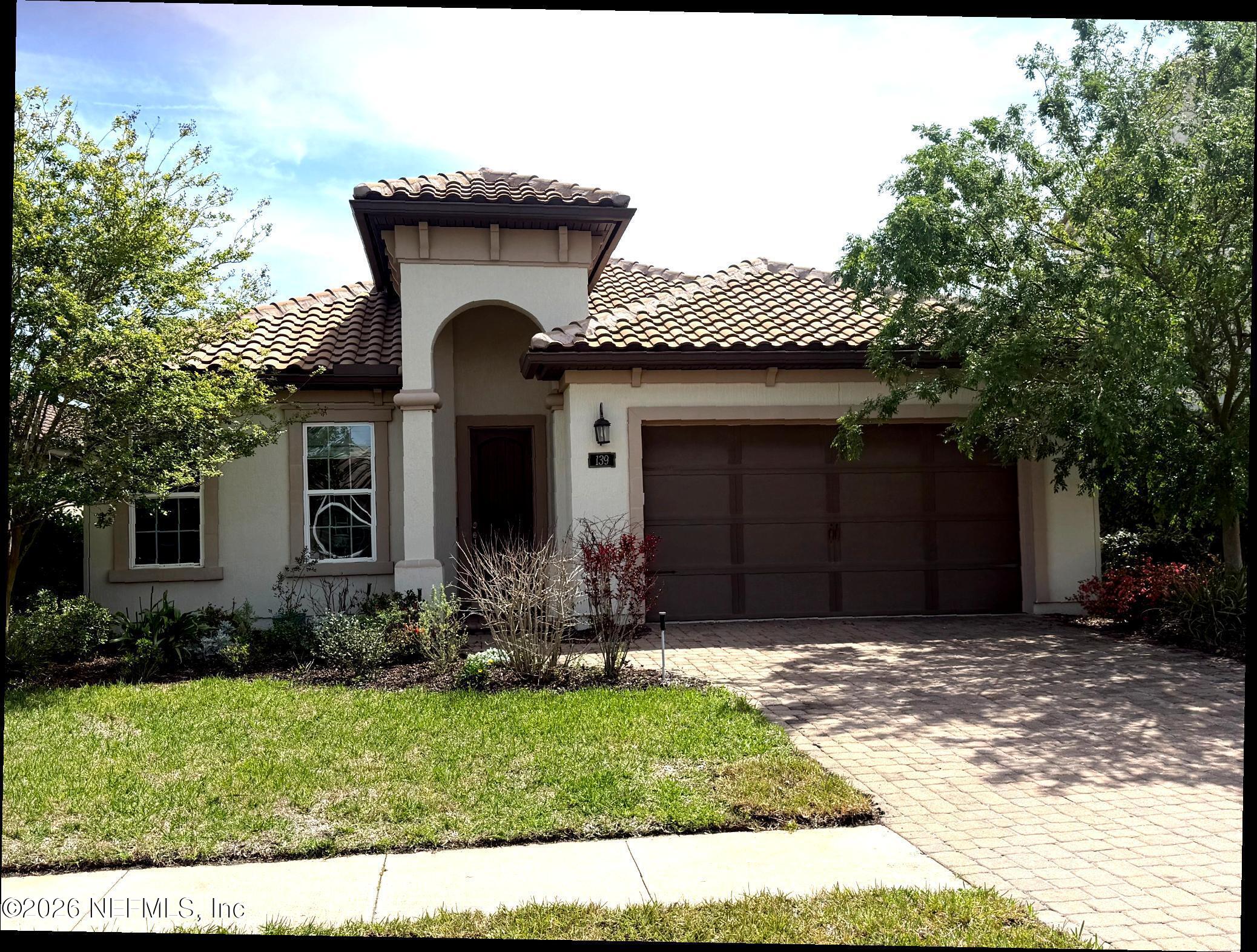 139 Rialto Drive Ponte Vedra, FL 32081 - Photo 1 of 1 a front view of a house with a yard and garage