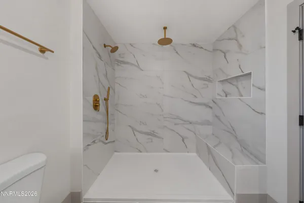 a bathroom with a tub and shower