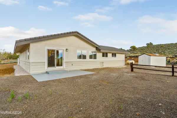 a view of a house with a yard and garage