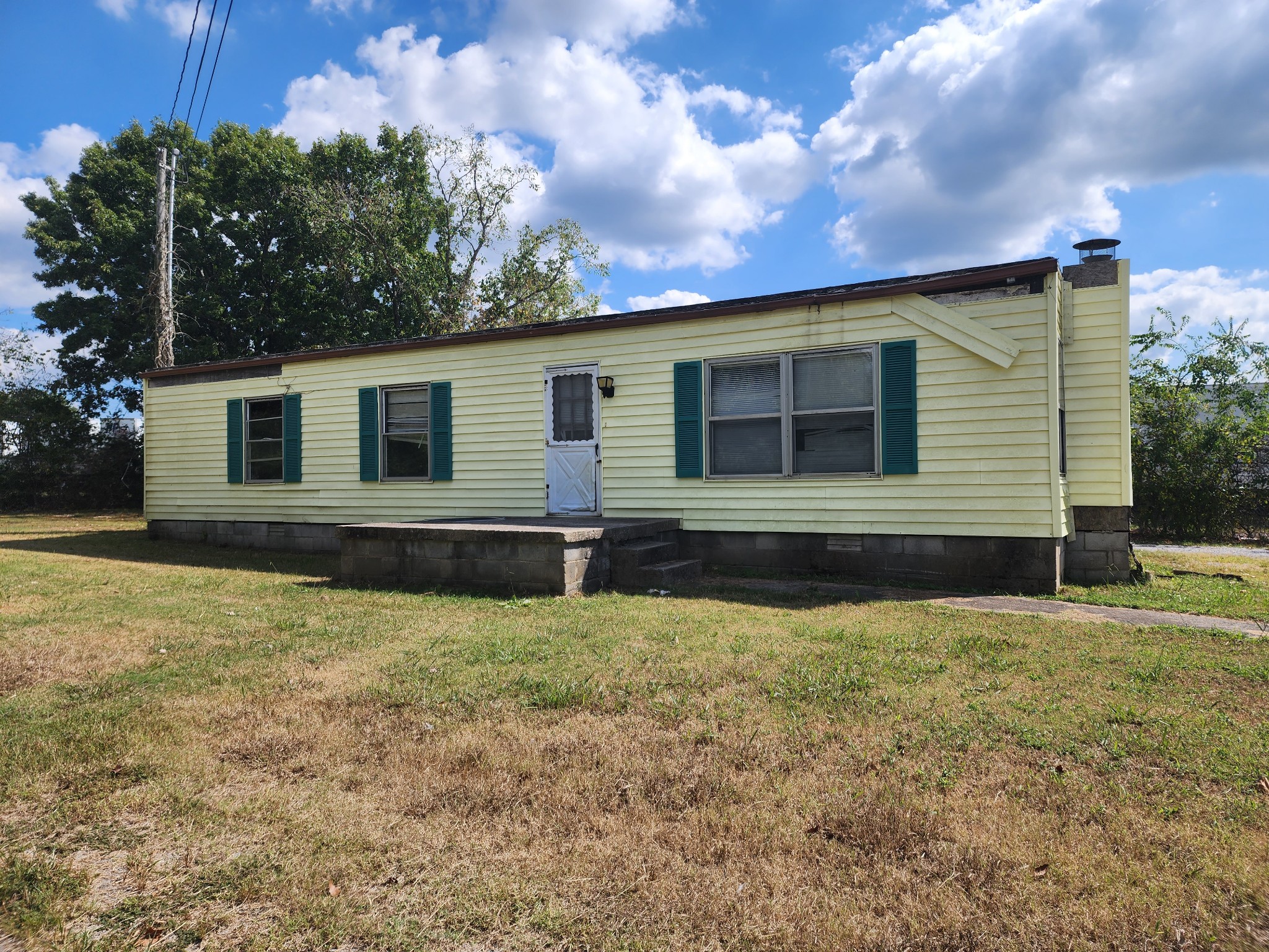 front view of a house with a yard