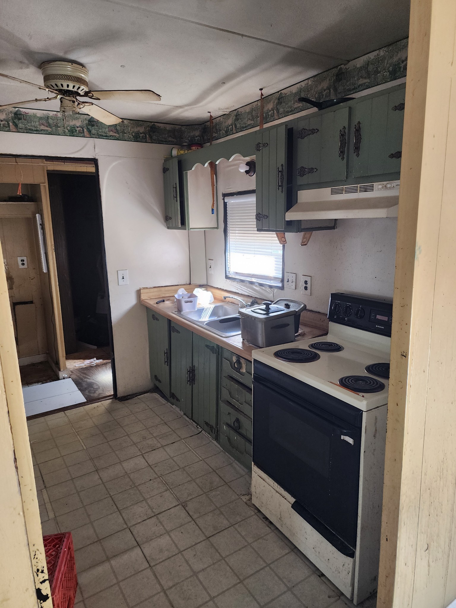 75 Dedman Street Lebanon, TN 37087 - Photo 3 of 8 a kitchen with stainless steel appliances granite countertop a sink and cabinets