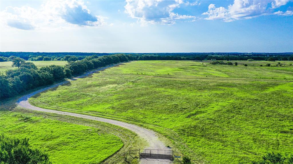 2215 Denver Road Sunset, TX 76270 - Photo 5 of 36 a view of a big room with a big yard