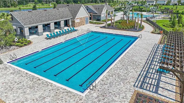 an aerial view of a house with garden space ocean view
