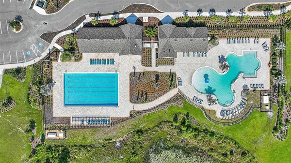 a view of a lake with couches and city view