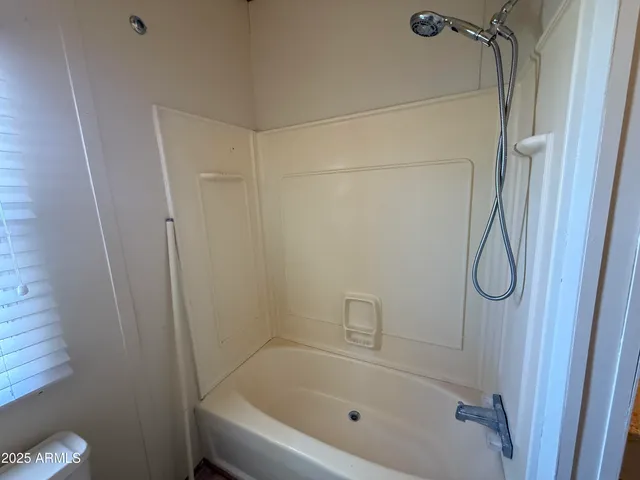 a bathroom with a bath tub