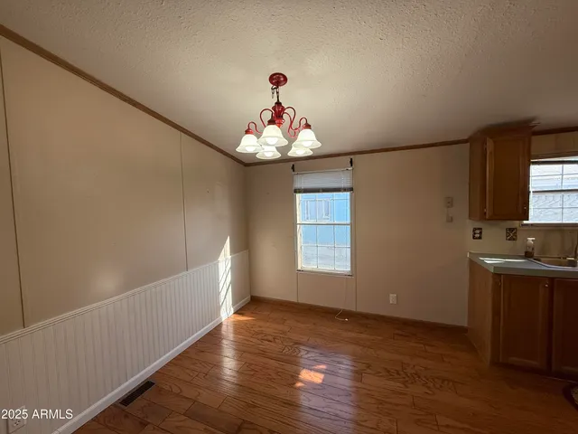 a very nice looking room with wooden floor