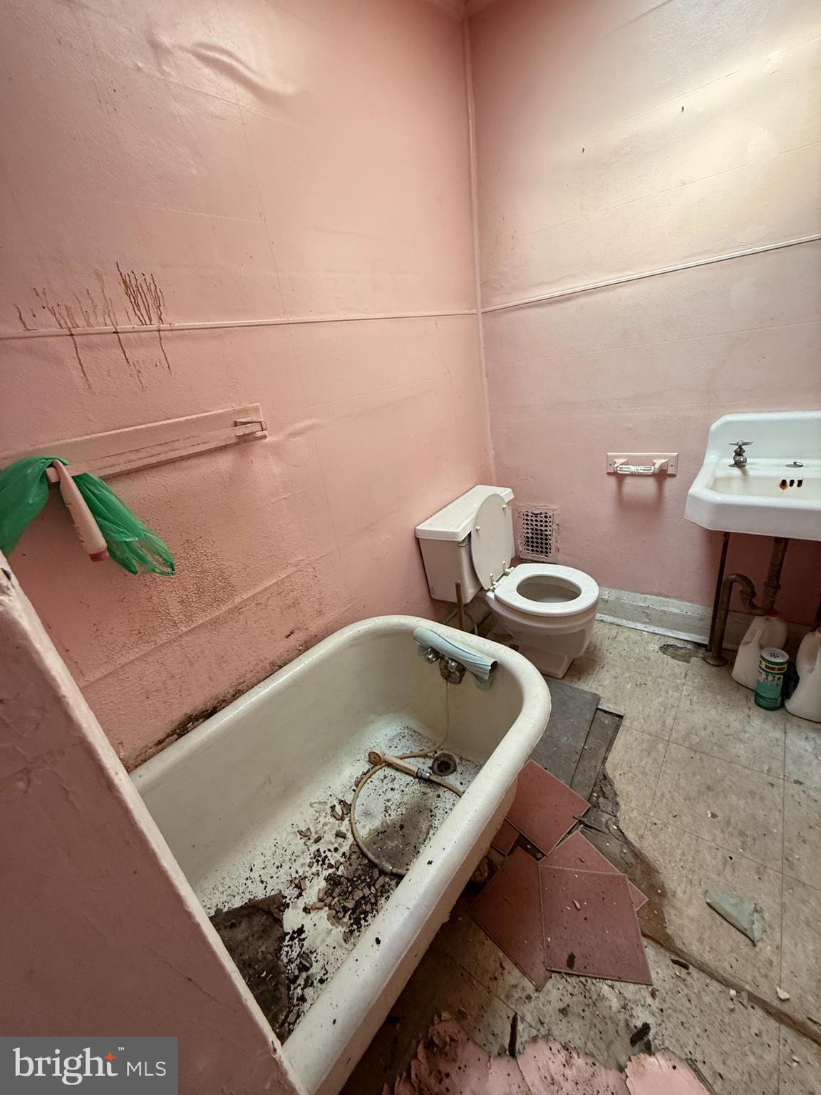 4919 Eastern Avenue Baltimore, MD 21224 - Photo 14 of 17 a bathroom with a sink and a toilet
