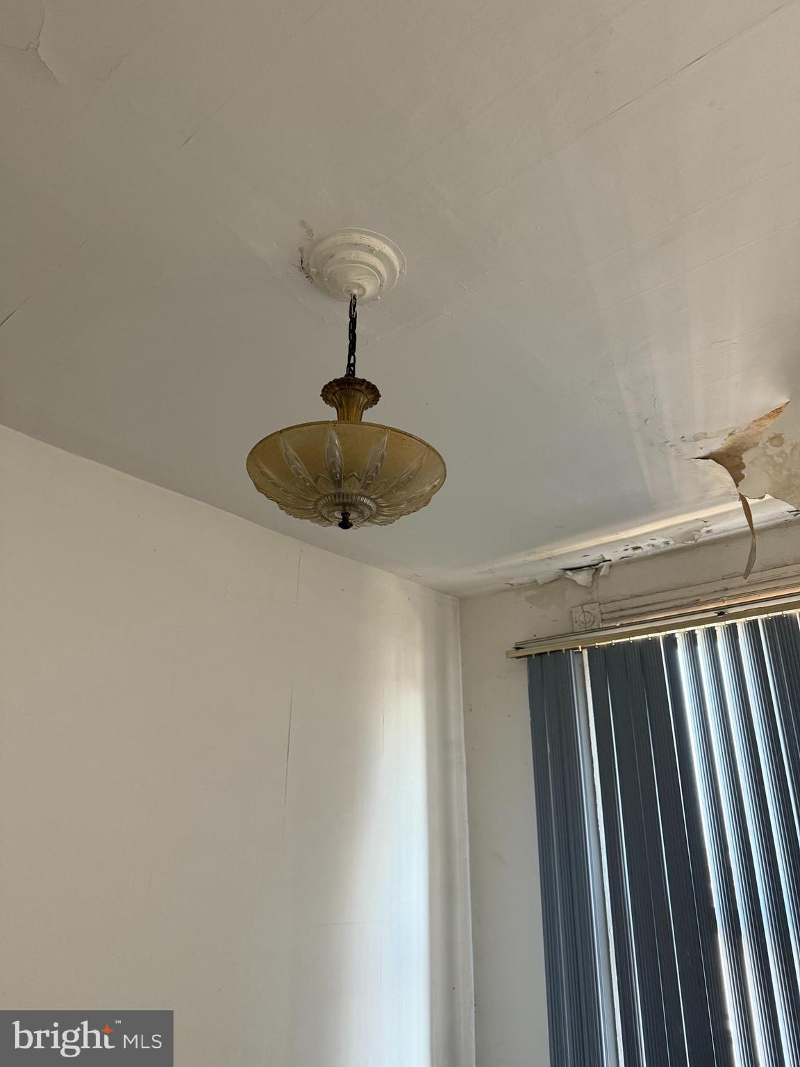 4919 Eastern Avenue Baltimore, MD 21224 - Photo 5 of 17 a view of a hallway with a chandelier