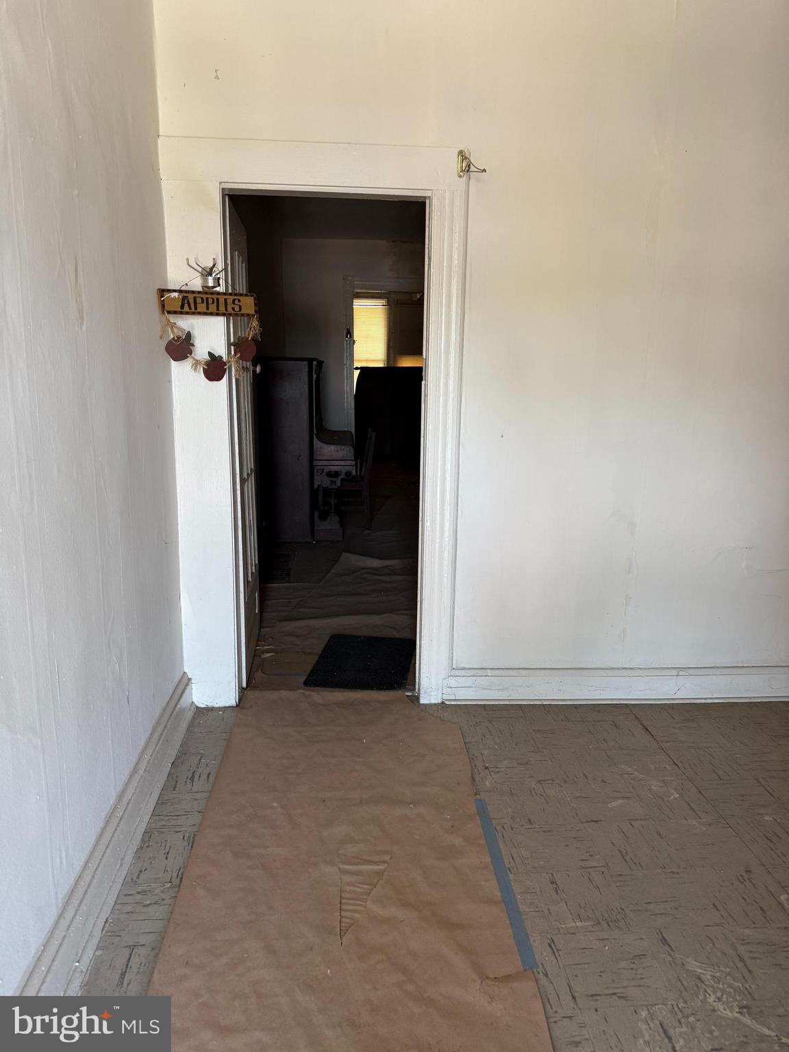 4919 Eastern Avenue Baltimore, MD 21224 - Photo 6 of 17 a view of a hallway with wooden floor and entryway