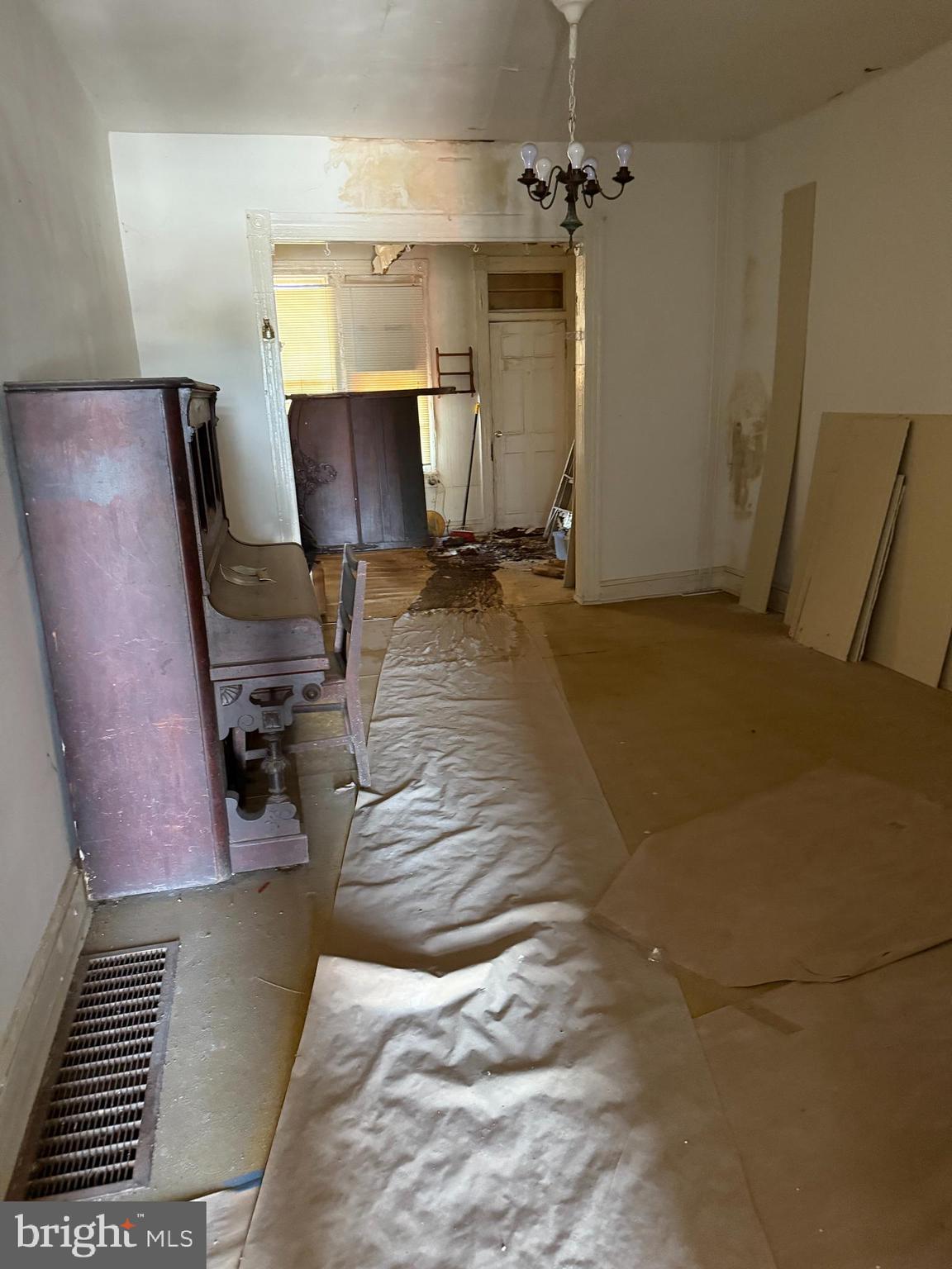 4919 Eastern Avenue Baltimore, MD 21224 - Photo 7 of 17 a bedroom with a bed and wooden floor