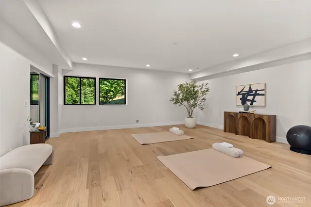 a living room with furniture and potted plants
