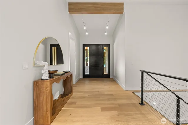 a view of a living room with furniture and a mirror