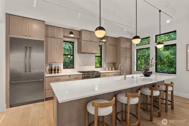 a kitchen with a table and chairs in it