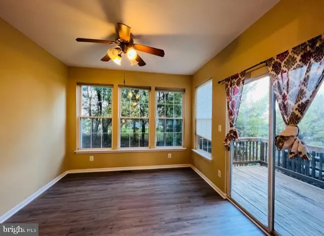 a view of room with window and hardwood floor