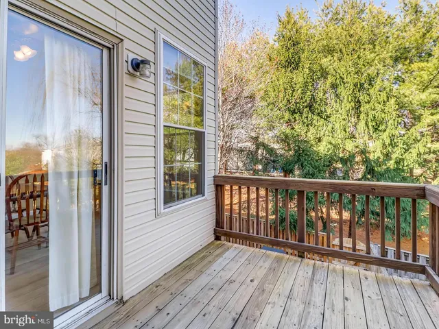 a view of balcony with wooden floor