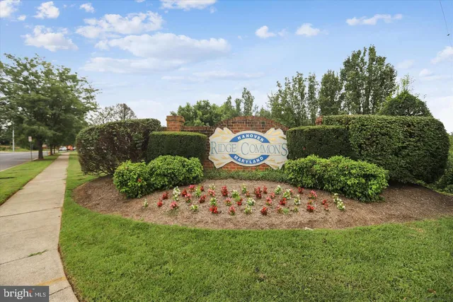 a view of a big house with a big yard and large trees