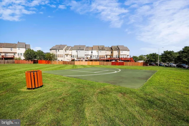 a view of a grassy field with trees