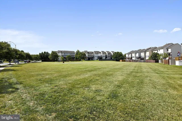 a view of a park with swings and slides